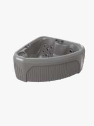 Grey freestanding hot tub with built-in seating and multiple massage jets on the interior wall edgease surface